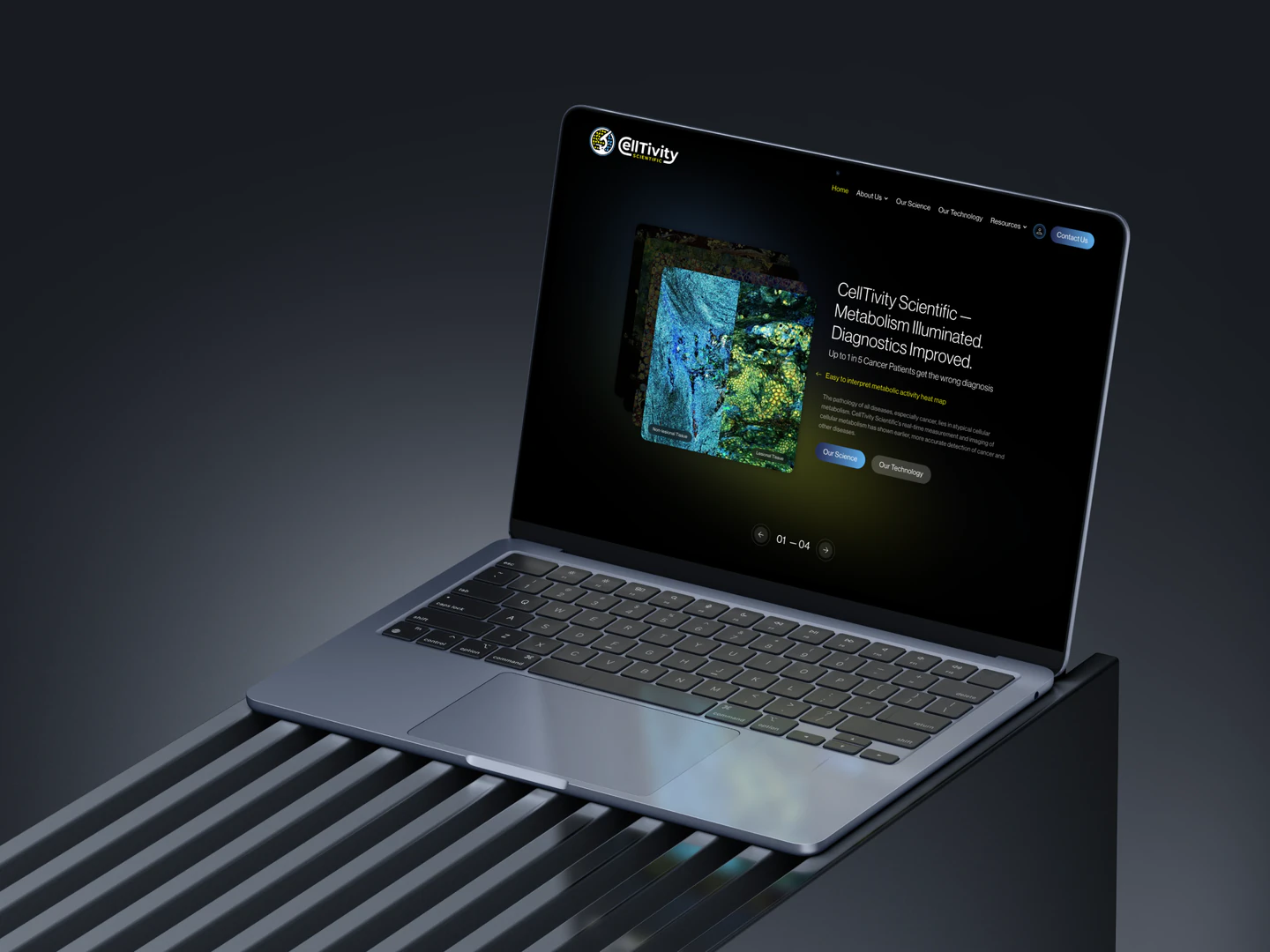 Celltivity homepage on a laptop resting on a metal bench