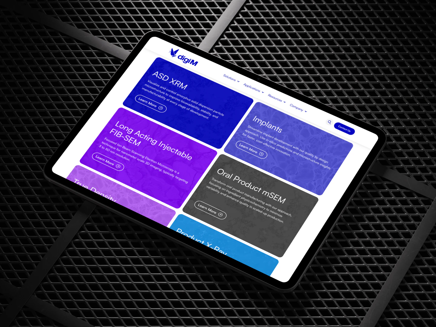 digiM applications page on a tablet resting on a metal grid