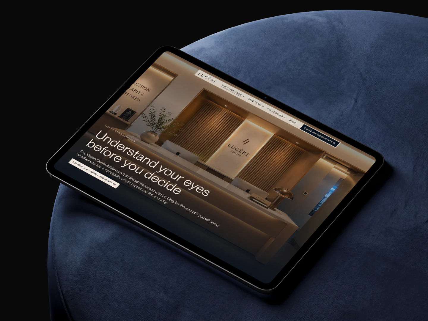 Lucēre Vision consultation page displayed on a tablet on a blue chair