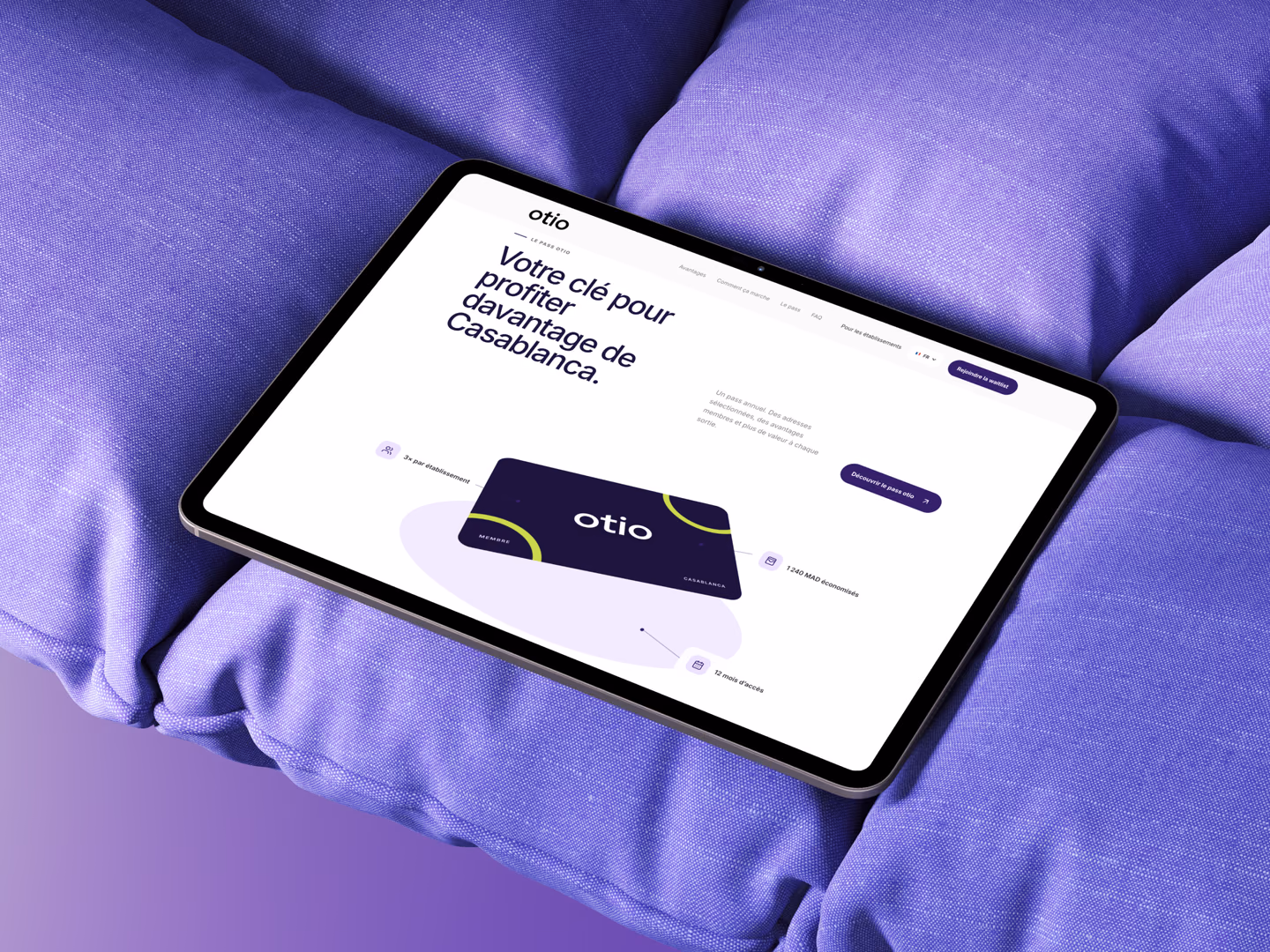 Otio membership pass page displayed on a tablet on purple cushions