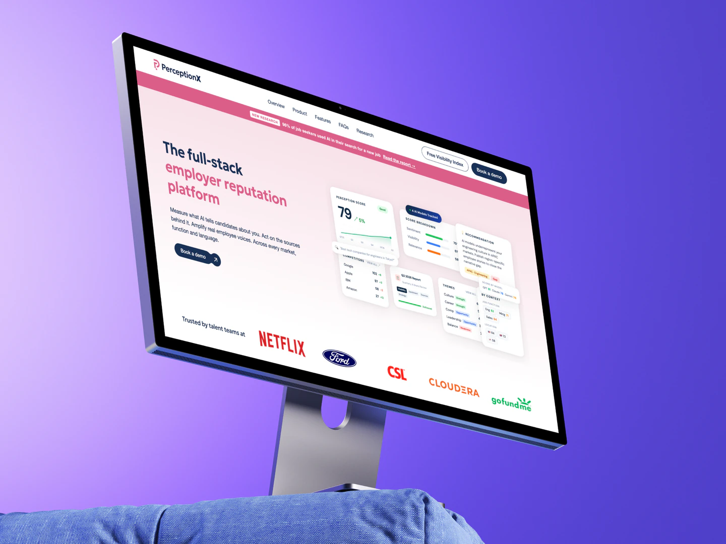 PerceptionX homepage on a desktop monitor against a purple background