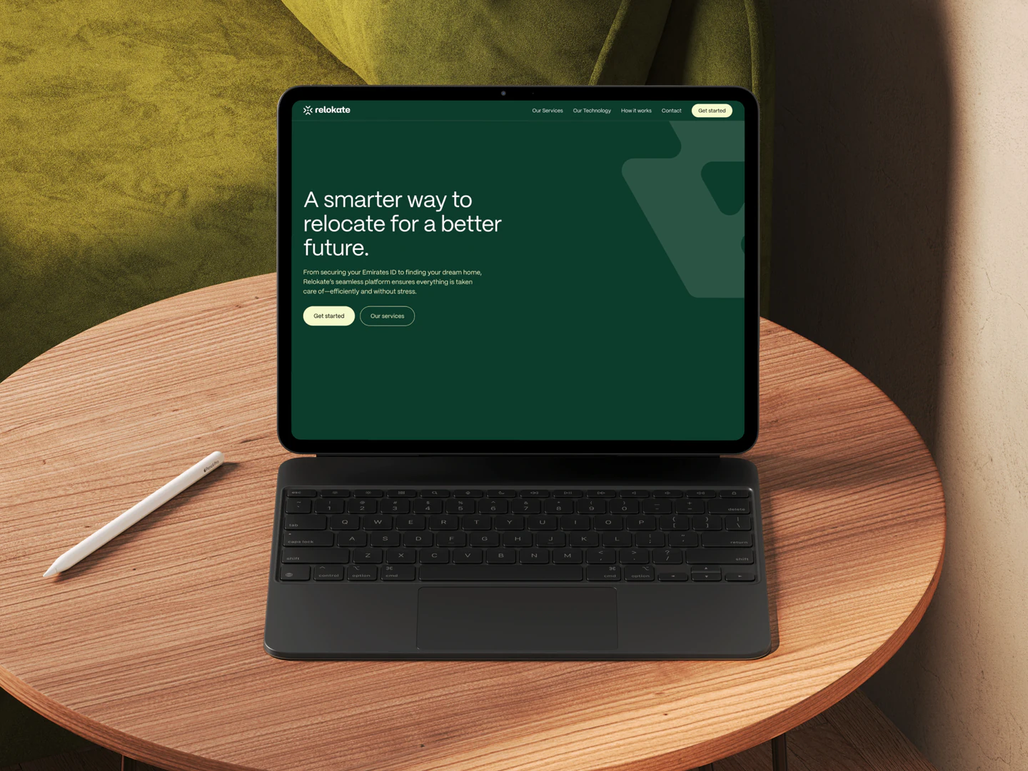 Relokate homepage on a tablet with keyboard on a wooden table