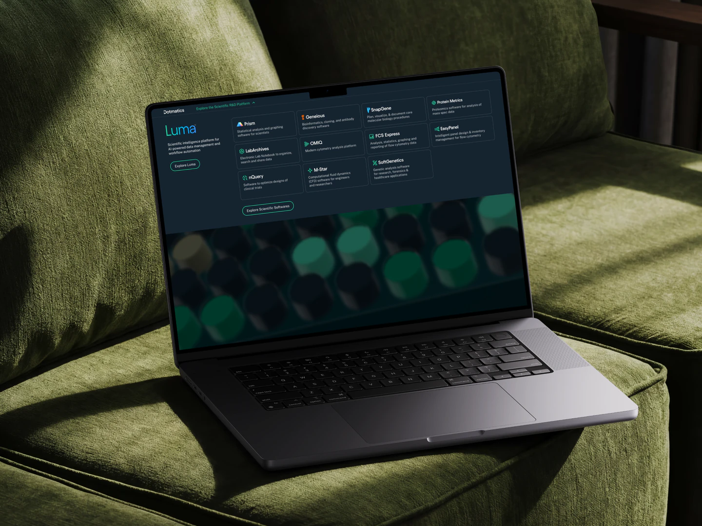 Virscidian homepage and product navigation displayed on a laptop on a green chair