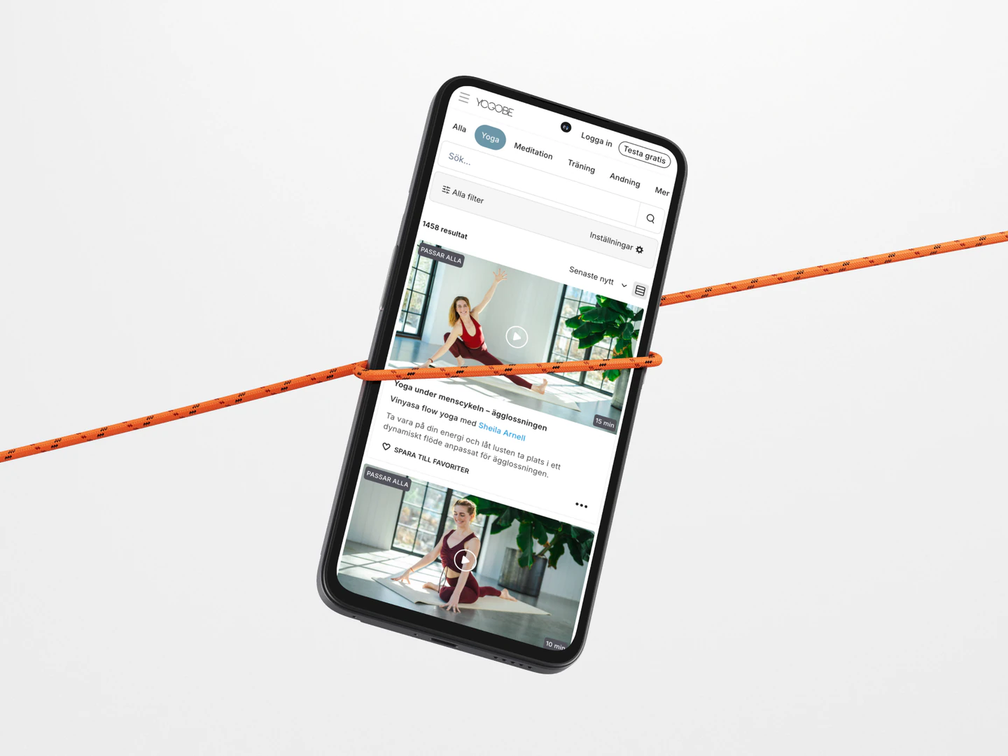 Yogobe mobile video library on a phone suspended from an orange cord